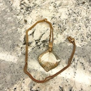 Kendra Scott rose gold necklace with unique stone